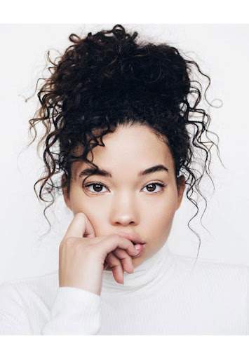 A messy top knot hairstyle