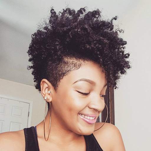 Coily pixie hairstyle with long layers